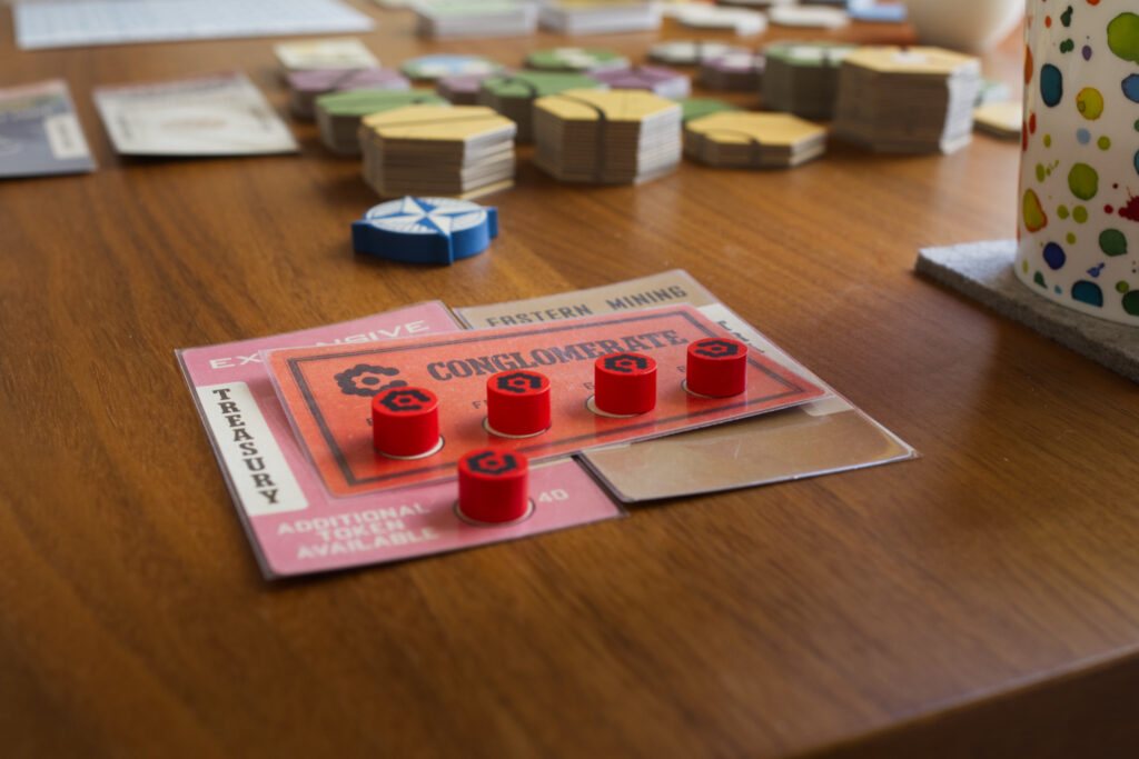 A major company formed by merging two minor companies, with hub markers. From board game Railways of the Lost Atlas