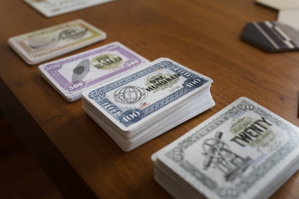 Card money from board game Railways of the Lost Atlas