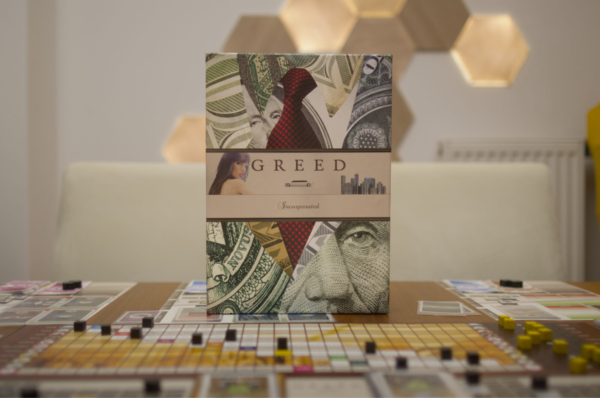 Greed Incorporated box with components in front of it